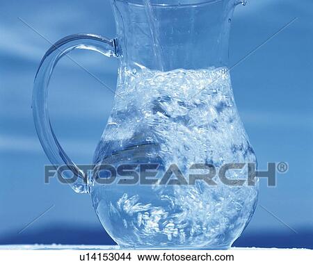 Picture - Pouring Water Into the Pitcher, Close Up, Differential Focus, In Focus, Out Focus,. Fotosearch