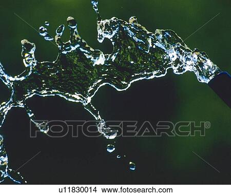 Water Spilling Out From a Bottle, Close Up, Differential Focus, In Focus, Out Focus, View Large Photo Image Picture - Water Spilling Out From a Bottle, Close Up, Differential Focus, In Focus, Out Focus,. Fotosearch