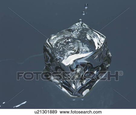 Stock Photo - Ice Cube In Water, Close Up, . Fotosearch