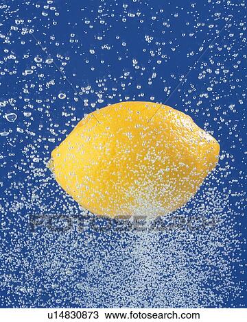 Stock Image - Lemon and Splash, Close Up, Front View, Differential Focus, In Focus, Out Focus,. Fotosearch
