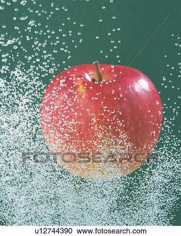 Stock Image - Red Apple and Splash, Close Up, Front View, . Fotosearch