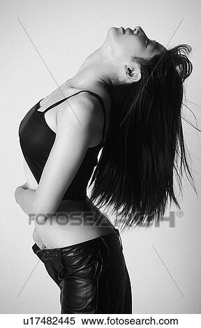 Portrait of a woman bending over backwards, black and white, side view, white background View Large Photo Image Stock Photography - Portrait of a woman bending over backwards, black and white, side view, white background. Fotosearch