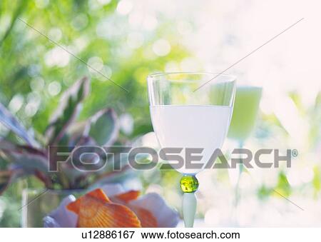 Stock Photo - Drink in Glass, Low Angle View, Close Up, Differential Focus, In Focus, Out Focus. Fotosearch
