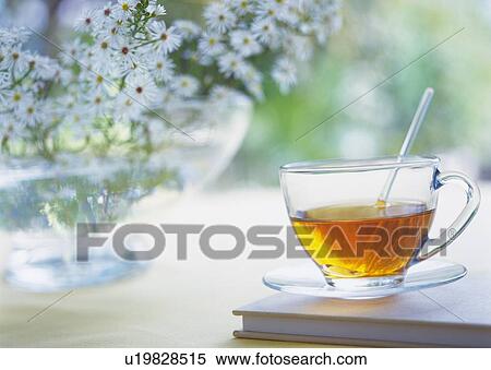 Stock Photography - Flowers and Tea Set, Close Up, Differential Focus, In Focus, Out Focus. Fotosearch
