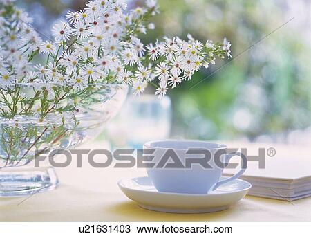 Stock Image - Flowers in Vase and Tea Set, Close Up, Differential Focus, In Focus, Out Focus. Fotosearch