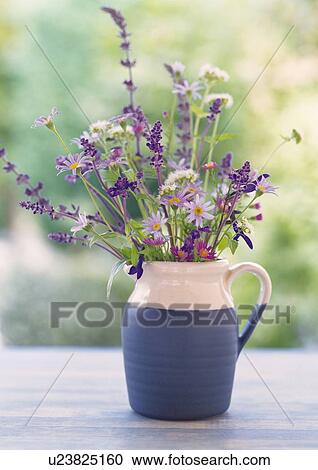 Stock Image - Flowers in Vase on Table, Close Up, Differential Focus, In Focus, Out Focus. Fotosearch
