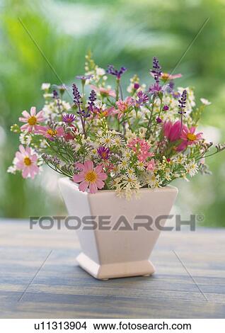 Picture - Flowers in Vase on Table, Front View, Close Up, Differential Focus, In Focus, Out Focus. Fotosearch