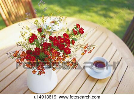 Red and Orange Flowers and Tea Set on Table, High Angle View, Close Up, Differential Focus, In Focus, Out Focus View Large Photo Image Stock Photo - Red and Orange Flowers and Tea Set on Table, High Angle View, Close Up, Differential Focus, In Focus, Out Focus. Fotosearch