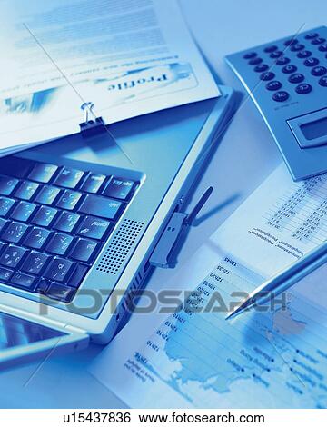 Stock Photograph - A Desktop in Business Office, High Angle View, Toned Image. Fotosearch