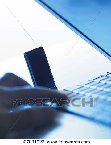 Stock Image - Fingers Pressing Keyboard, Close Up, Differential Focus, In Focus, Out Focus. Fotosearch