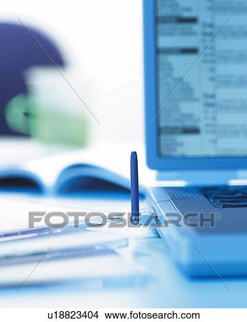 Picture - Notebook Computer on Desk, Close Up, Differential Focus, In Focus, Out Focus,. Fotosearch