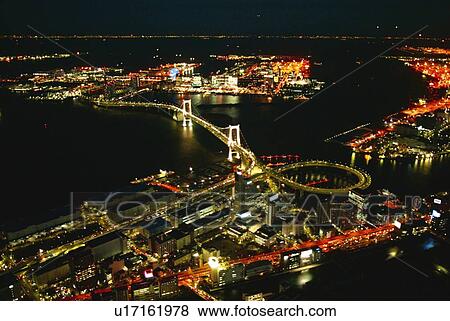 Stock Photo - Night View of Rainbow Bridge, Aerial View, Long Exposure. Fotosearch