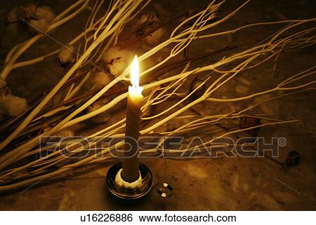 Stock Photograph - Lighting Candle, High Angle View. Fotosearch