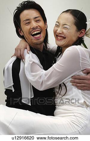 Man in Black Holding Woman in White, Front View, Side, View View Large Photo Image Stock Image - Man in Black Holding Woman in White, Front View, Side, View. Fotosearch