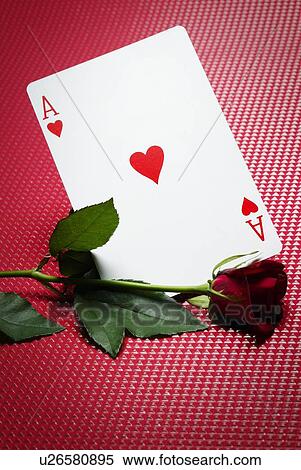 Stock Photography - Red Rose and Ace of Hearts, High Angle View. Fotosearch