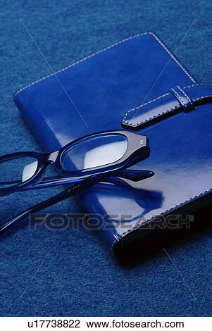 Stock Image - Schedule Book and Glasses, High Angle View. Fotosearch