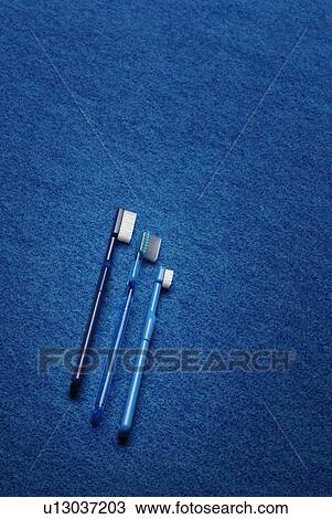 Stock Image - Three Toothbrushes, High Angle View, Copy Space. Fotosearch