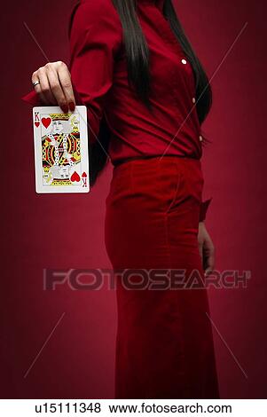 Stock Photo - Woman Showing a Card, Side View. Fotosearch