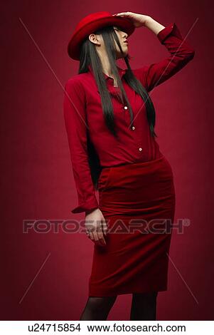 Picture - Woman Wearing a Red Hat, Side View. Fotosearch