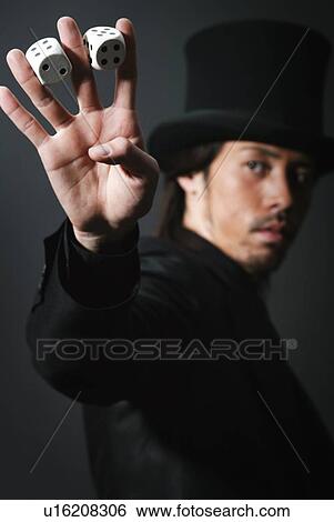 Young Man in Black and Two Dices, Close Up View Large Photo Image Stock Photograph - Young Man in Black and Two Dices, Close Up. Fotosearch