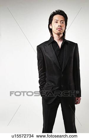 Young Man in Black Standing, Front View View Large Photo Image Picture - Young Man in Black Standing, Front View. Fotosearch