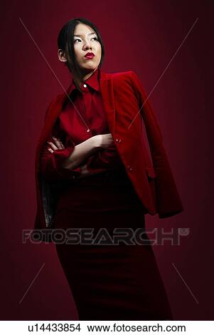 Picture - Young Woman Folding Arms, Low Angle View. Fotosearch