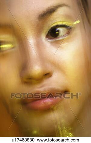 Stock Image - Young Woman, Front View, Close Up, Differential Focus. Fotosearch