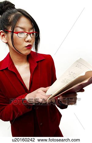Stock Image - Young Woman in Red Wearing Glasses, Front View. Fotosearch