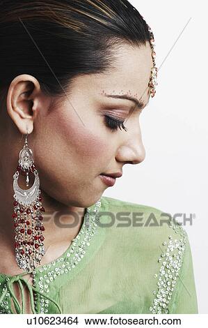 Picture - Close-up of a young woman looking down. Fotosearch