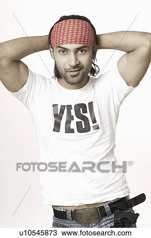 Portrait of a young man with his hands behind his head View Large Photo Image Stock Image - Portrait of a young man with his hands behind his head. Fotosearch
