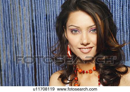 Stock Photo - Portrait of a young woman smiling. Fotosearch