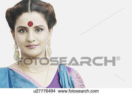 Picture - Portrait of a young woman wearing a sari. Fotosearch