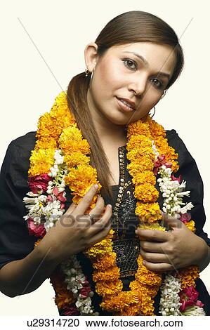 Portrait of a young woman wearing garlands View Large Photo Image Stock Image - Portrait of a young woman wearing garlands. Fotosearch