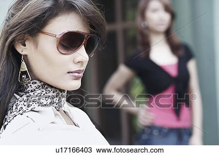 Side Profile Of A Young Woman Wearing Sunglasses Stock Image U17166403 Fotosearch