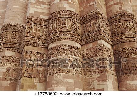 Stock Image - Close-up of the stone wall of a monument, Qutub Minar, New Delhi, India. Fotosearch
