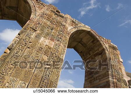 Low angle view of an arched gateway, Qutab Minar, New Delhi, India View Large Photo Image Stock Photograph - Low angle view of an arched gateway, Qutab Minar, New Delhi, India. Fotosearch
