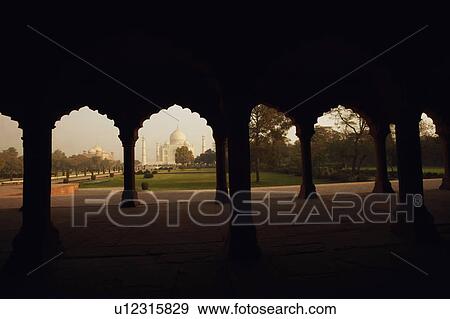 Mausoleum viewed through an arch, Taj Mahal, Agra, Uttar Pradesh, India View Large Photo Image Stock Photo - Mausoleum viewed through an arch, Taj Mahal, Agra, Uttar Pradesh, India. Fotosearch