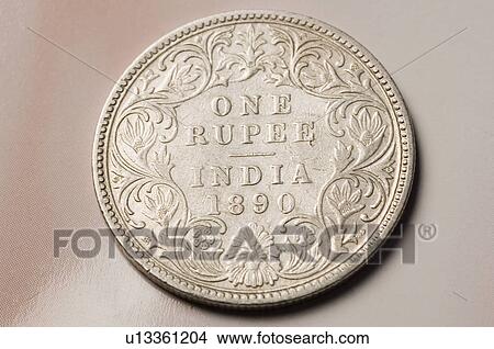 Close-up of an antique Indian one rupee coin View Large Photo Image Picture - Close-up of an antique Indian one rupee coin. Fotosearch