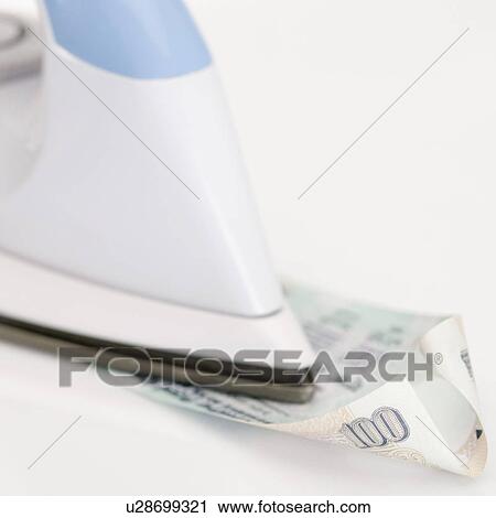 Close-up of an iron over an Indian one hundred rupee banknote View Large Photo Image Stock Image - Close-up of an iron over an Indian one hundred rupee banknote. Fotosearch