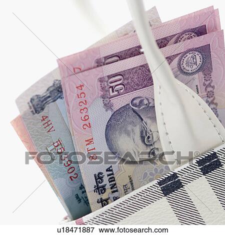 Stock Photo - Close-up of Indian banknotes of different denominations in a bag. Fotosearch