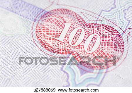Stock Photo - Close-up of one hundred Dinar banknote. Fotosearch