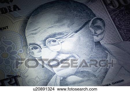 Picture - Close-up of picture of Mahatma Gandhi printed on an Indian one hundred rupee banknote. Fotosearch