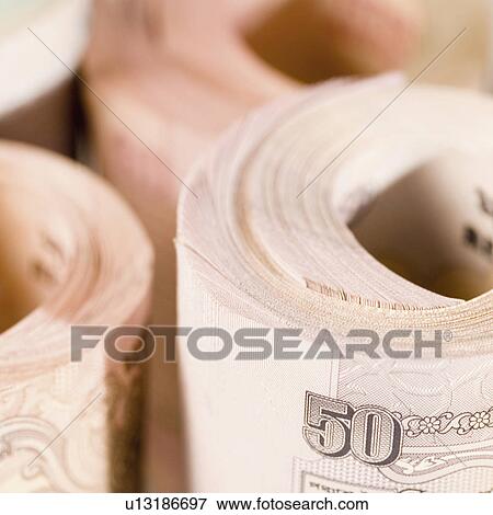 Close-up of rolled up bundles of Indian banknotes View Large Photo Image Stock Photo - Close-up of rolled up bundles of Indian banknotes. Fotosearch