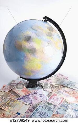 High angle view of a globe on a heap of Indian banknotes and Euro banknotes View Large Photo Image Stock Photo - High angle view of a globe on a heap of Indian banknotes and Euro banknotes. Fotosearch