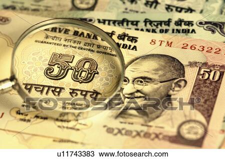 High angle view of a magnifying glass on an Indian fifty rupee banknote View Large Photo Image Stock Image - High angle view of a magnifying glass on an Indian fifty rupee banknote. Fotosearch