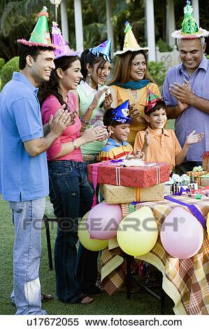 Group of people celebrating a birthday party View Large Photo Image Stock Photography - Group of people celebrating a birthday party. Fotosearch