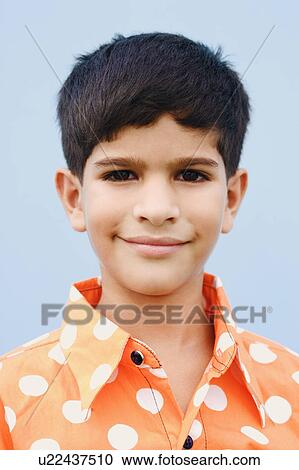 Stock Image - Portrait of a boy smirking. Fotosearch