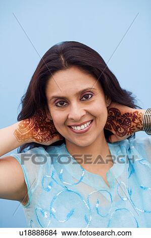 Portrait of a mid adult woman smiling View Large Photo Image Picture - Portrait of a mid adult woman smiling. Fotosearch