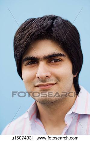 Stock Image - Portrait of a young man smiling. Fotosearch