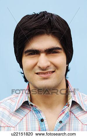 Stock Image - Portrait of a young man smiling. Fotosearch